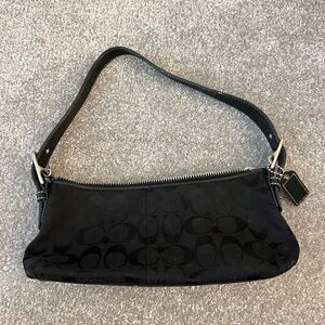 Coach black bag with buckle strap; like new